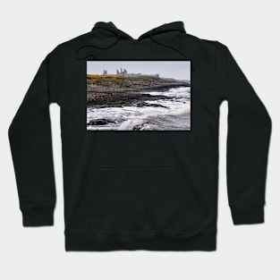 Waves battering the coast near Dustanburgh castle Northumberland, UK Hoodie